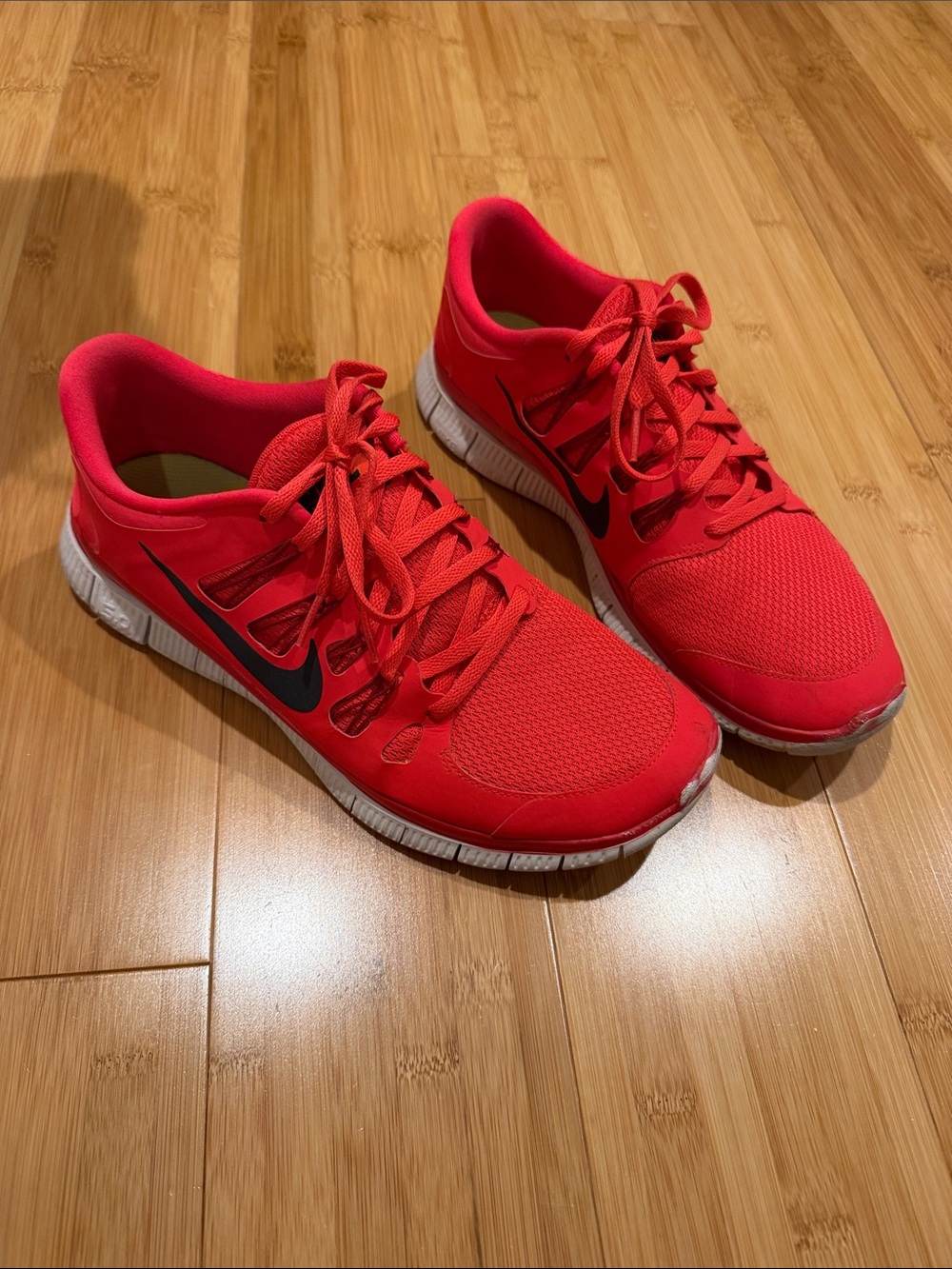 Nike mens Red Athletic Running Shoes with Black Swoosh
